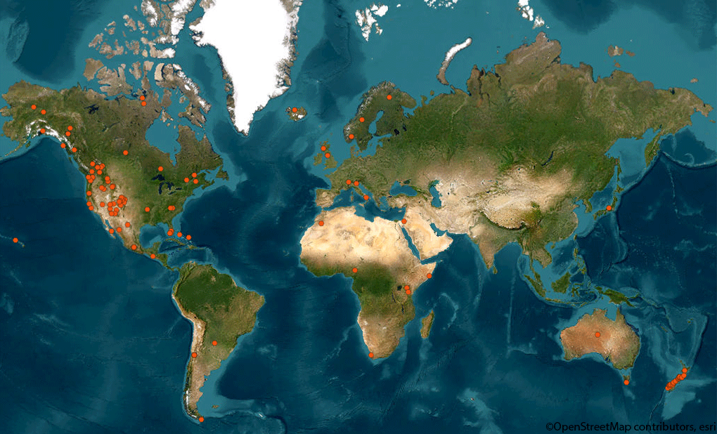 A world map showing locations where SOS signals were triggered from inReach devices, indicated by orange dots, set against a backdrop of continents and oceans. 